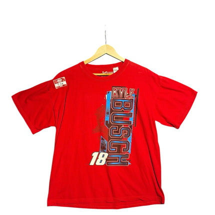OutOf10 red Kyle Busch NASCAR graphic t-shirt with number 18 and Joe Gibbs Racing branding on a wooden hanger.