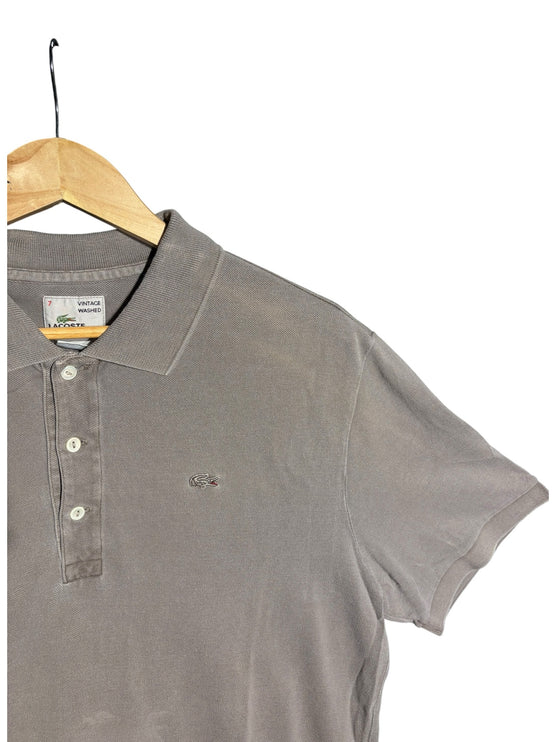OutOf10 Lacoste vintage washed taupe cotton pique polo shirt with embroidered crocodile logo on a wooden hanger
