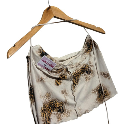 OutOf10 leopard print satin mini skirt with a silky smooth finish hanging on a wooden hanger