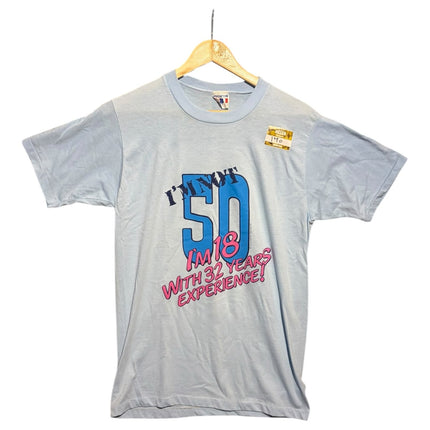OutOf10 light blue vintage graphic t-shirt with 50th birthday slogan print on a wooden hanger