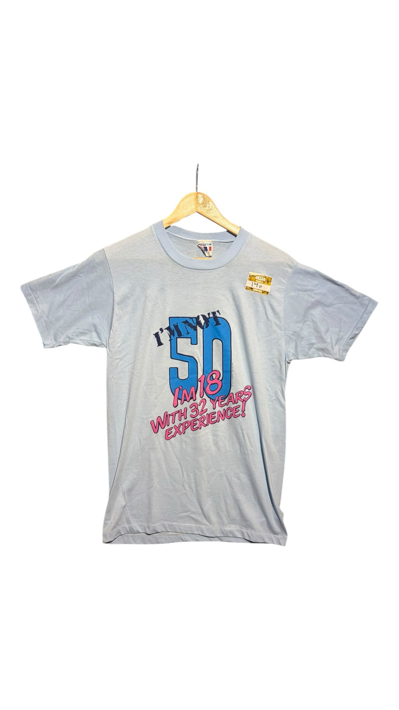 OutOf10 light blue vintage graphic t-shirt with 50th birthday slogan print on a wooden hanger