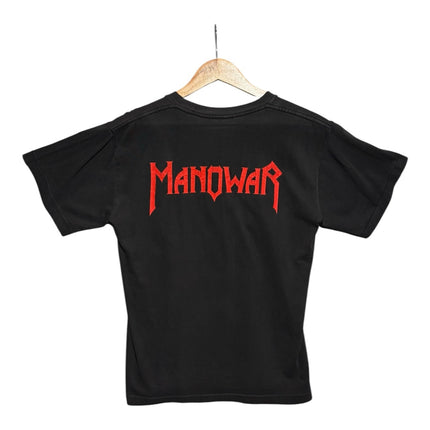 Back view of OutOf10 black cotton Manowar band t-shirt featuring a red logo graphic on a wooden hanger.
