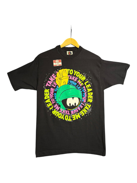OutOf10 black crewneck t-shirt featuring a vibrant Marvin the Martian graphic with neon text on a hanger