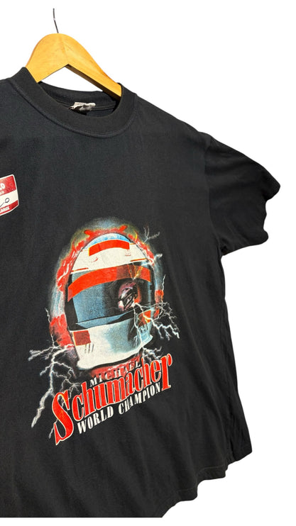 OutOf10 black cotton t-shirt featuring a Michael Schumacher racing helmet graphic with lightning and bold text.