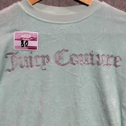 OutOf10 mint green velour long sleeve sweatshirt with silver metallic Juicy Couture logo on a wooden hanger