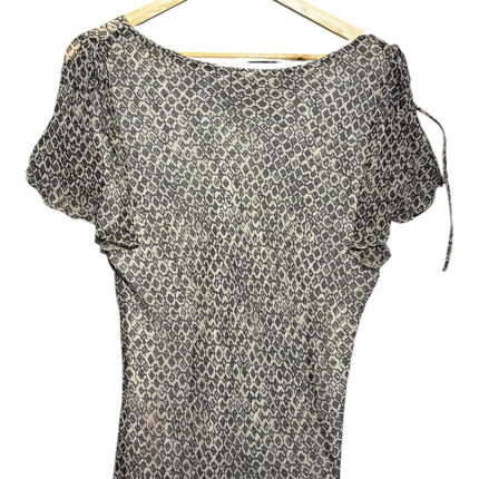OutOf10 monochrome geometric print V-neck blouse with flutter sleeves on a wooden hanger