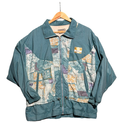OutOf10 vintage Montval teal windbreaker jacket with abstract patterned panels, full-zip front, and drawstring hem.