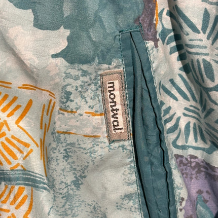 OutOf10 vintage Montval windbreaker jacket featuring a teal abstract pattern and a branded fabric label