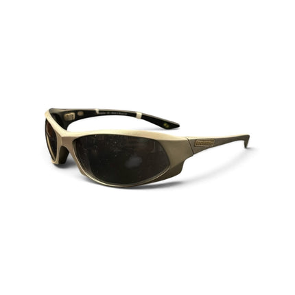 OutOf10 Mormaii performance wrap sunglasses with a matte gold frame and dark lenses for sports and outdoor activities.