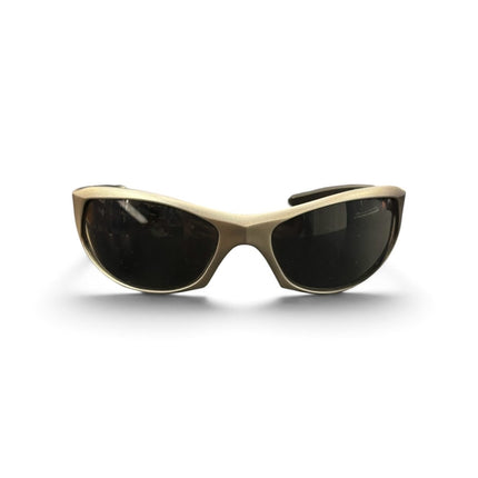 OutOf10 Mormaii performance wrap sunglasses featuring a matte gold frame and dark UV-protective lenses.