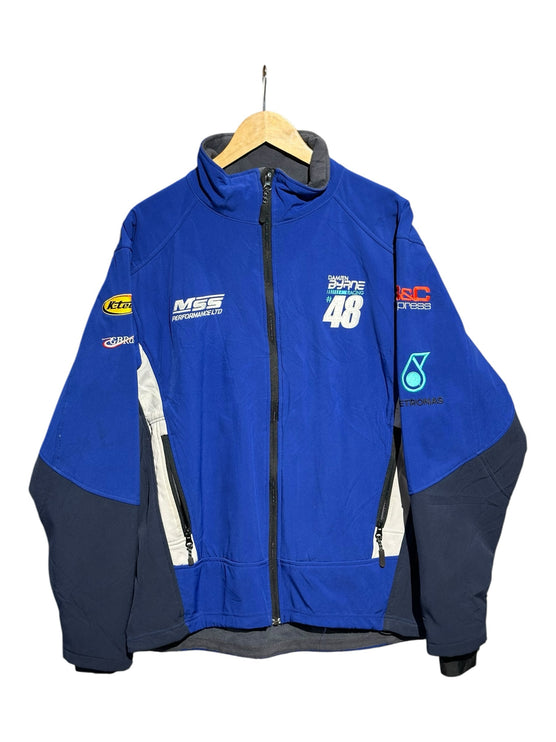OutOf10 royal blue and navy softshell racing jacket with MSS Performance and Damien Byrne Racing sponsor embroidery.