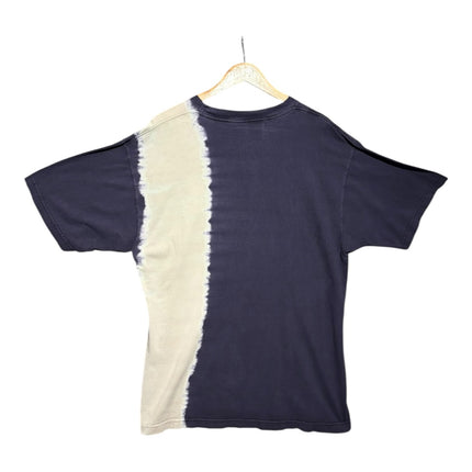 Back view of OutOf10 vintage-inspired navy and bleached white cotton t-shirt with an asymmetrical two-tone design.