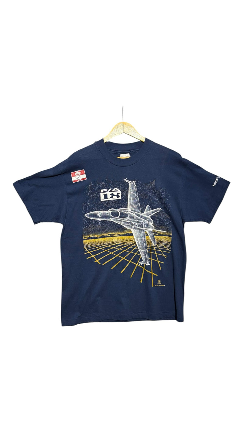 OutOf10 navy blue cotton t-shirt featuring a white F/A-18 fighter jet graphic over a golden grid landscape