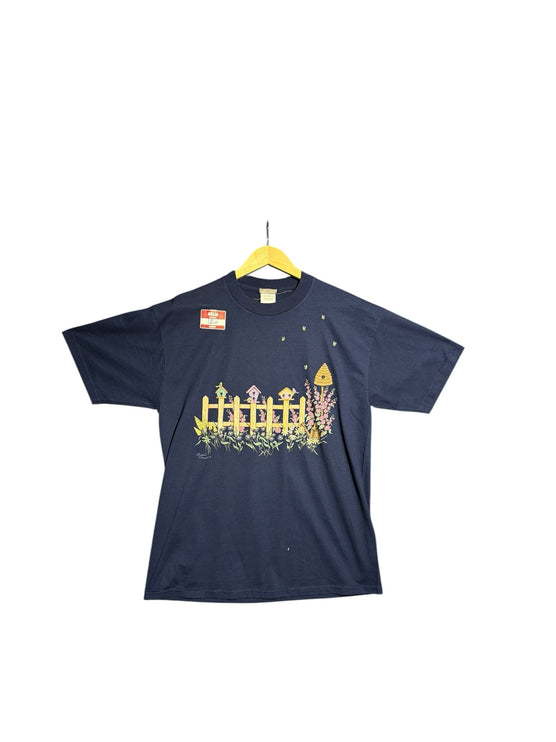 OutOf10 navy blue cotton t-shirt featuring a vintage garden graphic with birdhouses, flowers, and bees.