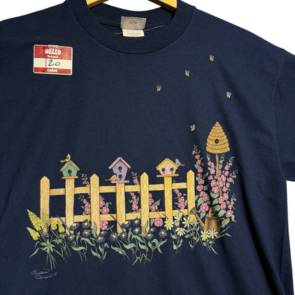 OutOf10 navy blue cotton t-shirt featuring a vintage garden graphic with birdhouses, flowers, and bees.