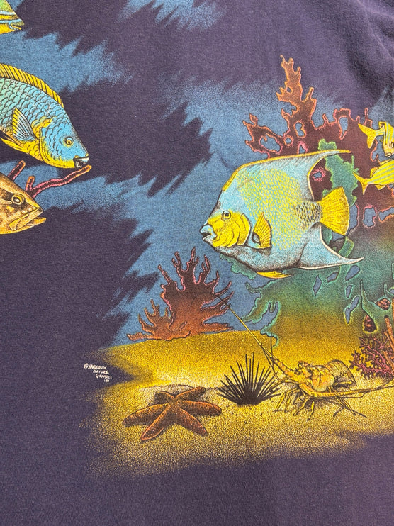 OutOf10 navy blue cotton t-shirt featuring a vibrant underwater scene with tropical fish, coral, and a sea turtle.