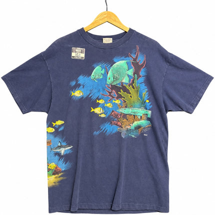 OutOf10 navy blue cotton t-shirt featuring a vibrant underwater graphic with tropical fish, a shark, and coral reef.
