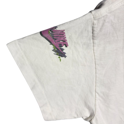 OutOf10 vintage white Nike t-shirt sleeve featuring a vibrant pink, purple, and green abstract brushstroke logo print.
