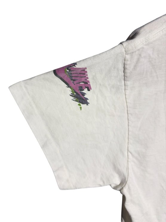 OutOf10 vintage white Nike t-shirt sleeve featuring a vibrant pink, purple, and green abstract brushstroke logo print.