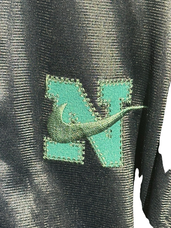 OutOf10 vintage Nike track jacket featuring a teal embroidered N logo with a green Swoosh on shimmering black fabric.