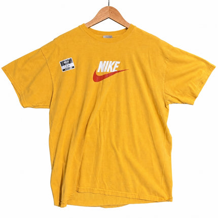 OutOf10 Nike yellow crew neck t-shirt with red and white logo on chest hanging on a wooden hanger