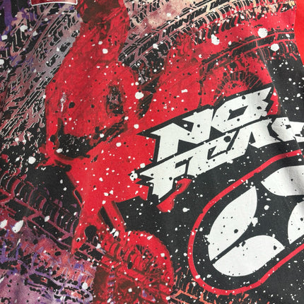 OutOf10 No Fear red graphic t-shirt with tire track motifs, paint splatter, and bold extreme sports branding