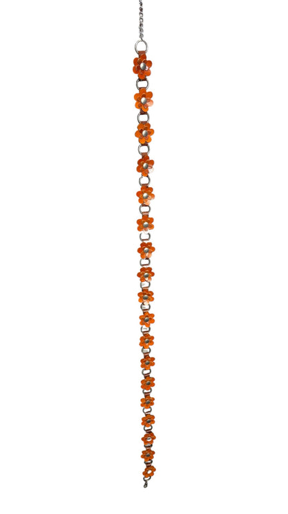 OutOf10 orange floral link chain belt with silver-tone metal rings and daisy motifs for a retro-inspired look.