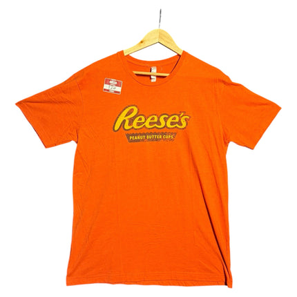 OutOf10 orange crewneck t-shirt featuring a distressed vintage Reese's Peanut Butter Cups graphic logo on the front.