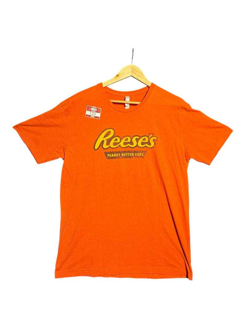 OutOf10 orange crewneck t-shirt featuring a distressed vintage Reese's Peanut Butter Cups graphic logo on the front.