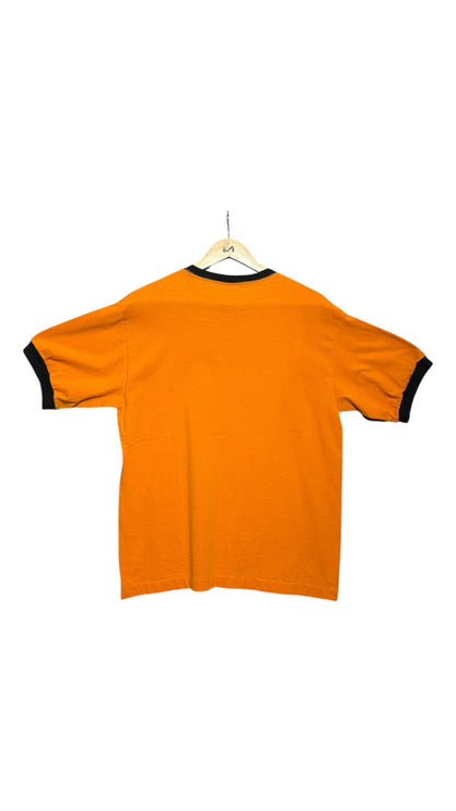 OutOf10 vintage-inspired orange ringer t-shirt with black crew neck and sleeve trim, back view on a wooden hanger.