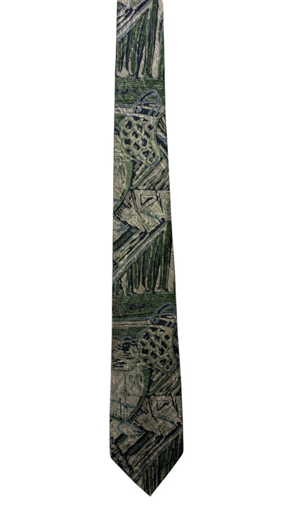 OutOf10 formal necktie featuring an abstract geometric pattern in forest green, grey, and earth tones.