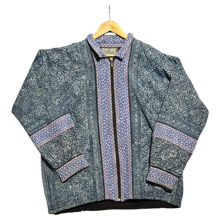 OutOf10 zip-up jacket featuring blue and lavender geometric heritage patterns on durable fabric with a classic collar.