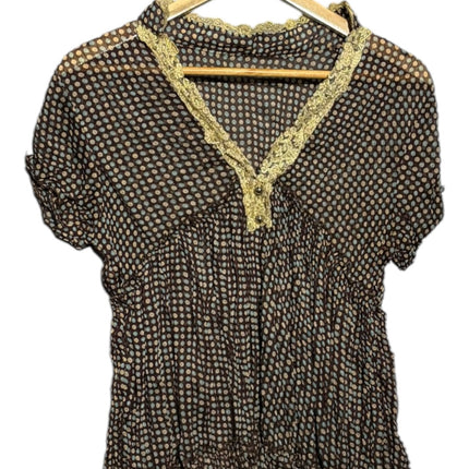 OutOf10 dark polka dot short sleeve blouse with gold lace V-neck trim and ruffled hem on a wooden hanger
