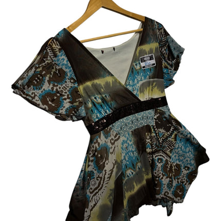 OutOf10 bohemian printed V-neck peplum blouse with flutter sleeves, sequin waistband, and handkerchief hemline.
