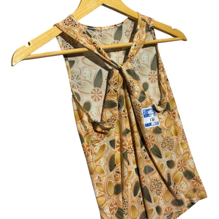 OutOf10 sleeveless racerback tank top in ochre, sage, and cream floral print with twisted back strap detail on hanger.