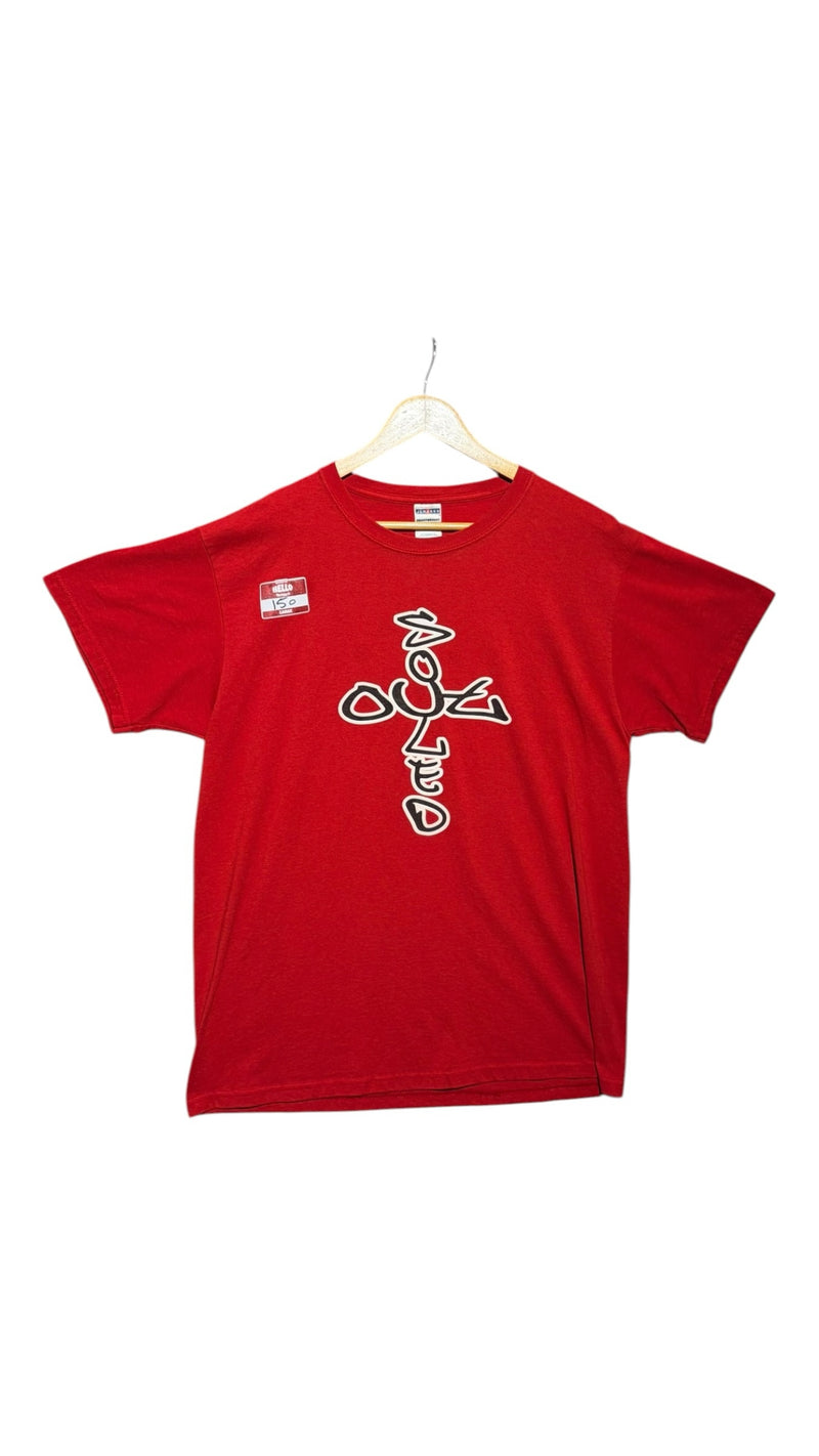 OutOf10 red cotton crewneck t-shirt featuring a stylized white and black cross graphic print on the front.