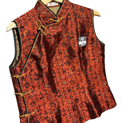 OutOf10 sleeveless red blouse with black calligraphy print, mandarin collar, and gold frog button closures.