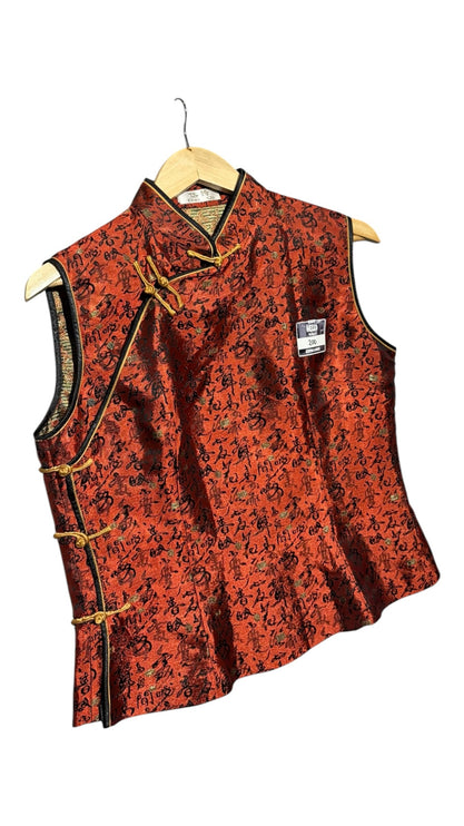 OutOf10 sleeveless red blouse with black calligraphy print, mandarin collar, and gold frog button closures.