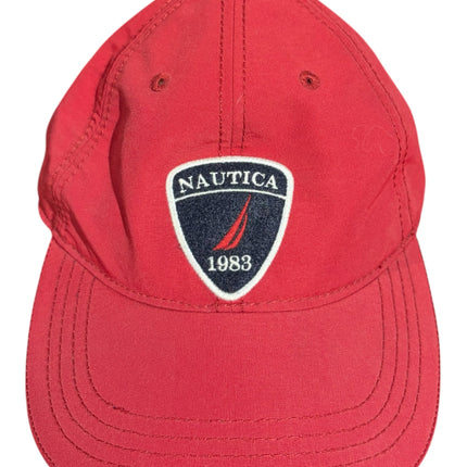 OutOf10 red Nautica baseball cap with a structured crown, curved brim, and embroidered 1983 logo patch on the front.