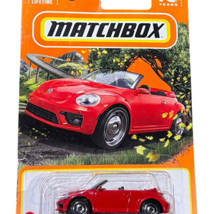 OutOf10 Matchbox 2019 Volkswagen Beetle Convertible diecast toy car in vibrant red, packaged on a 70th anniversary card.