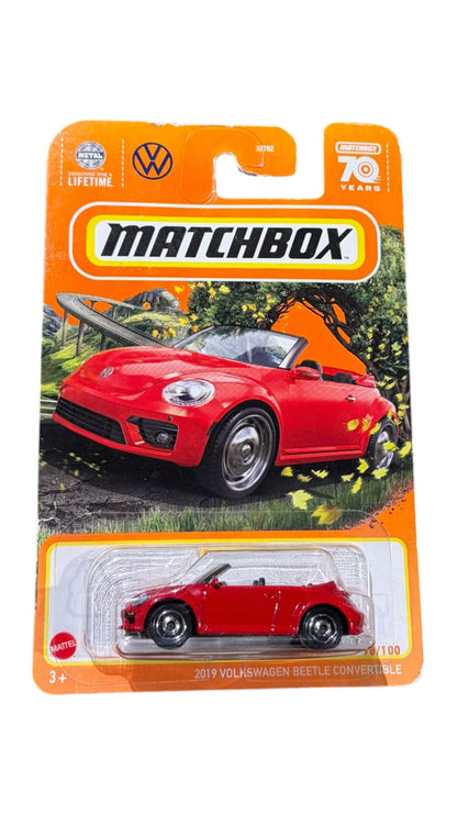OutOf10 Matchbox 2019 Volkswagen Beetle Convertible diecast toy car in vibrant red, packaged on a 70th anniversary card.