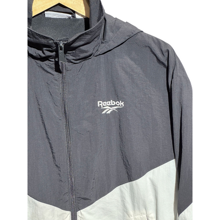 OutOf10 Reebok lightweight black and white hooded windbreaker jacket with a full-zip front and chest logo.