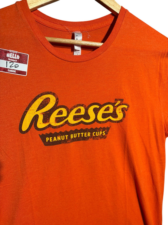 OutOf10 orange crewneck t-shirt featuring a vintage-style distressed Reese's Peanut Butter Cups graphic logo.