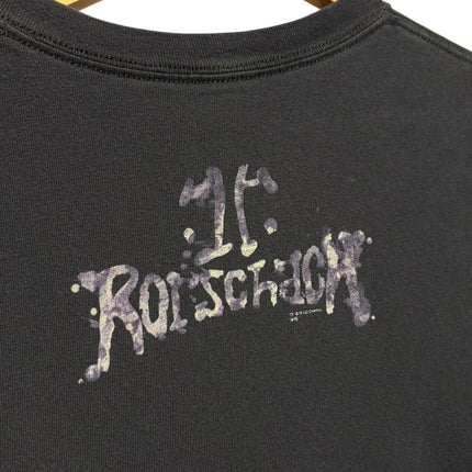 OutOf10 black cotton crewneck t-shirt featuring a distressed Rorschach logo print on the back hanging on a hanger