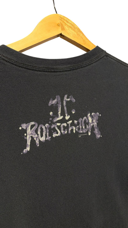 OutOf10 black cotton crewneck t-shirt featuring a distressed Rorschach logo print on the back hanging on a hanger