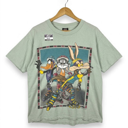 OutOf10 sage green Looney Tunes graphic t-shirt featuring Bugs Bunny, Daffy Duck, and Wile E. Coyote rollerblading.