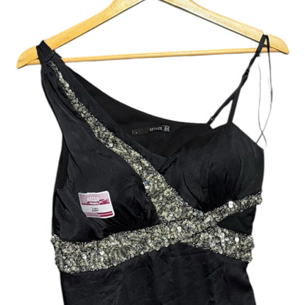 OutOf10 SEDUCE black one-shoulder evening dress with intricate silver beadwork on the bodice hanging on a wooden hanger