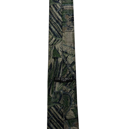 OutOf10 SIN DONG-A formal necktie featuring an abstract geometric pattern in forest green and muted grey tones.