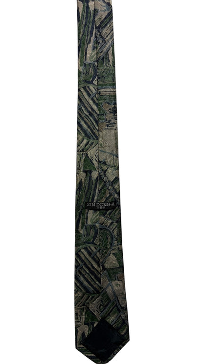OutOf10 SIN DONG-A formal necktie featuring an abstract geometric pattern in forest green and muted grey tones.