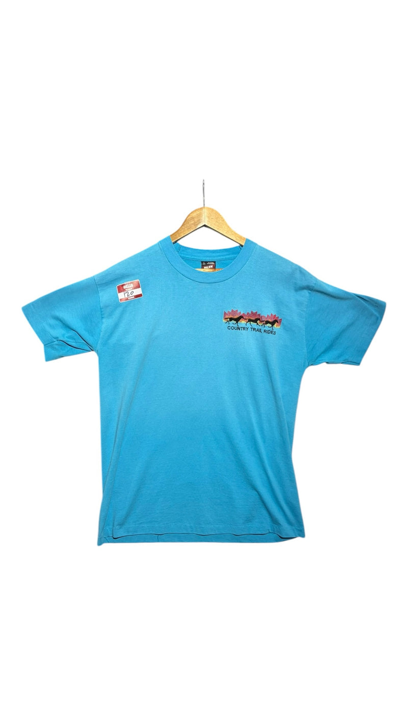 OutOf10 sky blue short sleeve t-shirt with a small Country Trail Rides horse graphic on the chest.
